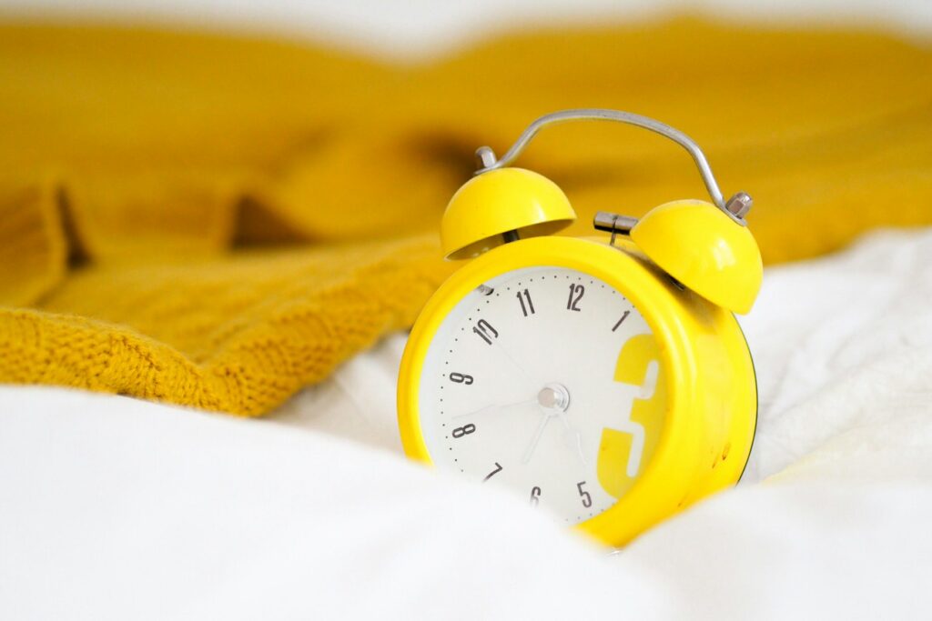 yellow alarm clock on bed waiting for SEO changes